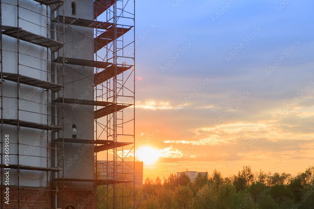 Orthodox Church Under Construction on sunset sky background