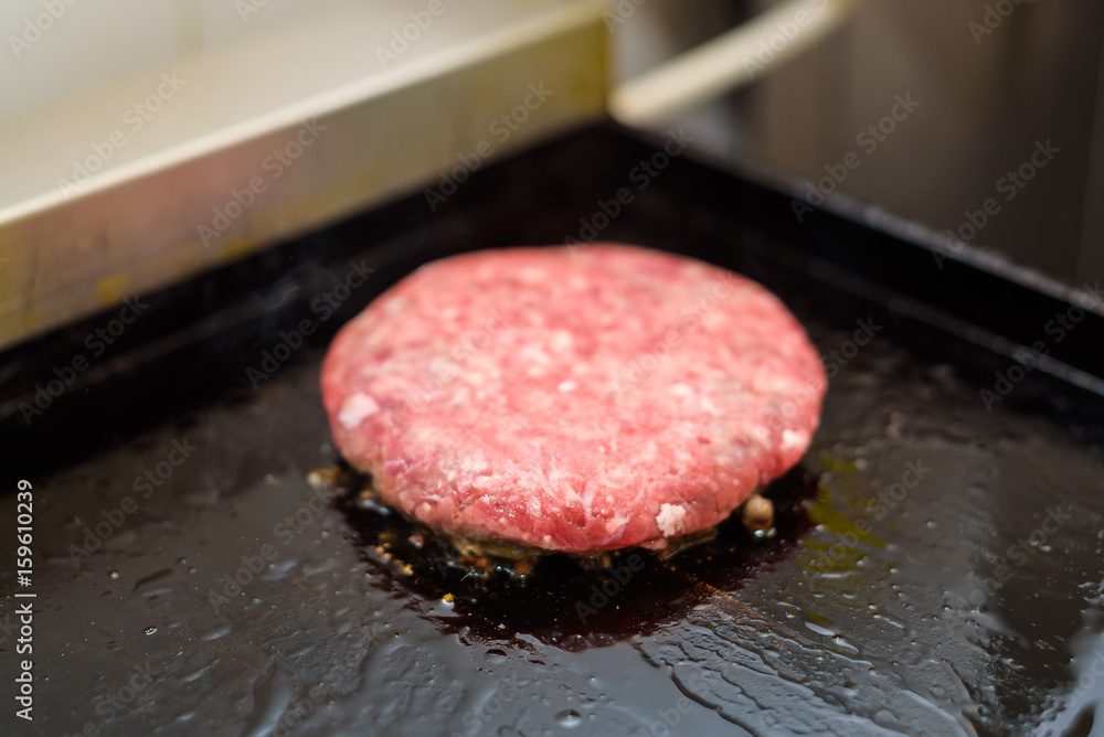 Preparing delicious hamburger patty Preparing delicious hamburger patty