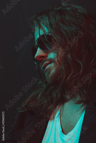 Εκτύπωση καμβά close up portrait of young long haired caucasian man in sunglasses