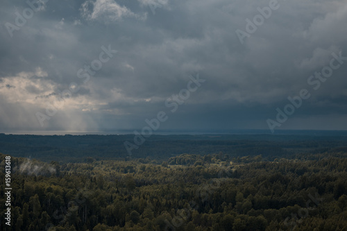 aerial view over the green forest in evening. Cloudy mystery. Landscapes of Latvia © Janis Baiks