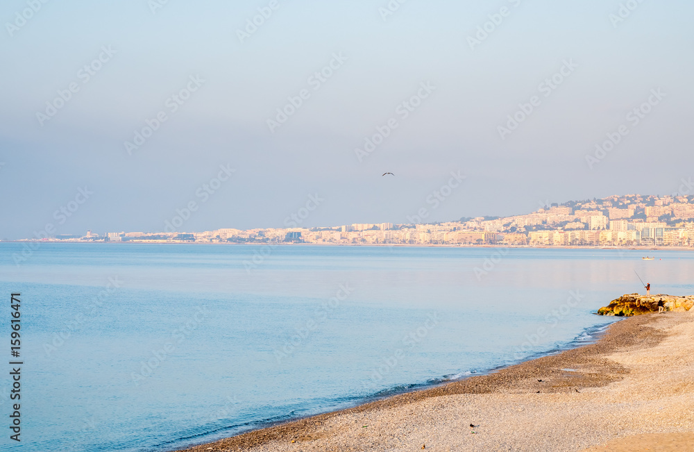 Coast line along Mediterranean sea in Nice, favorite vacation city in France, under morning sunlight