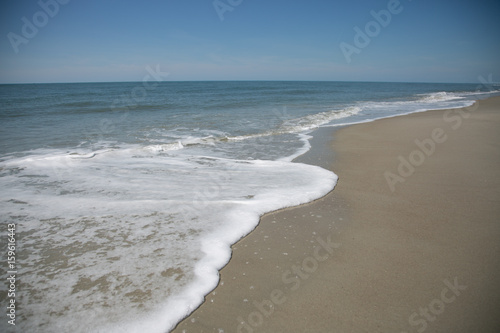 Morning tide on the sandy beach on the ocean