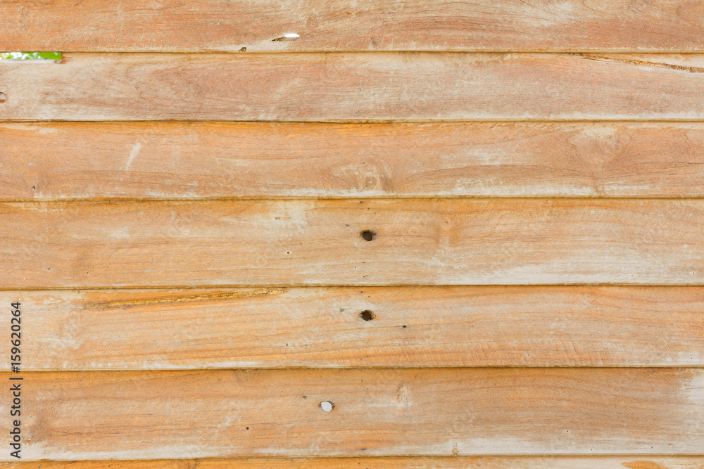 Fototapeta premium close-up brown color nature pattern detail of teak wood decorative furniture surface with copyspace