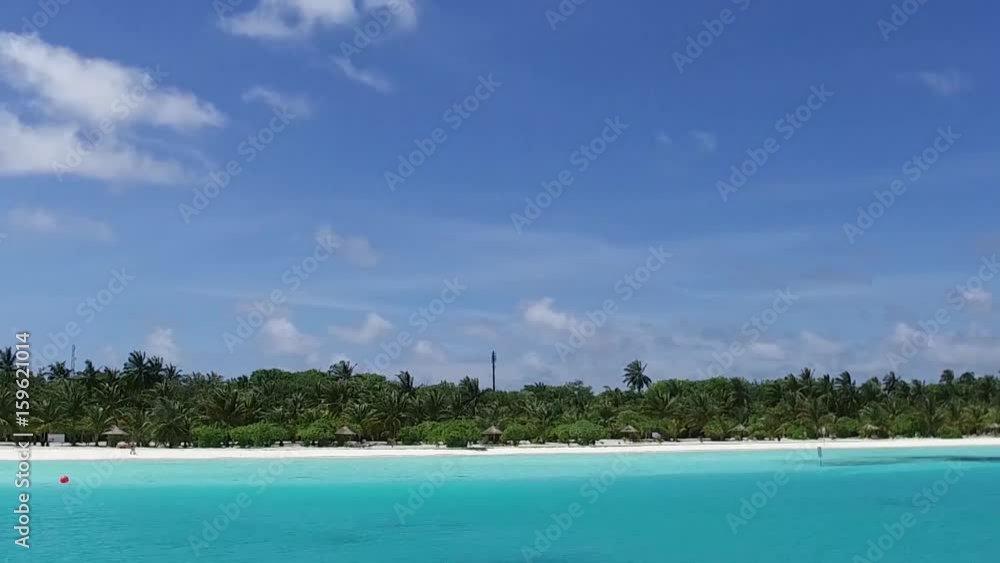 Lagoon and Bungalow on Maldives Island Lagoon and Bungalow on Maldives Island