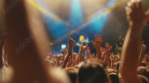 Iconic night rock concert front row crowd cheering hands in air slomo 100p
