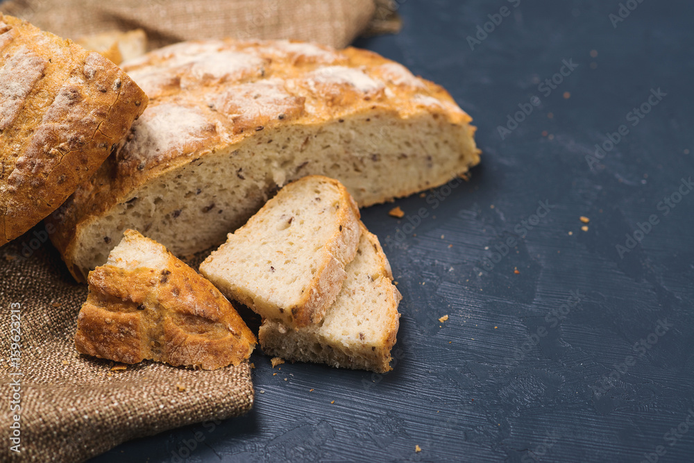 Whole wheat bread baked at home, bio ingredients, very healthy with seeds. copy space.
