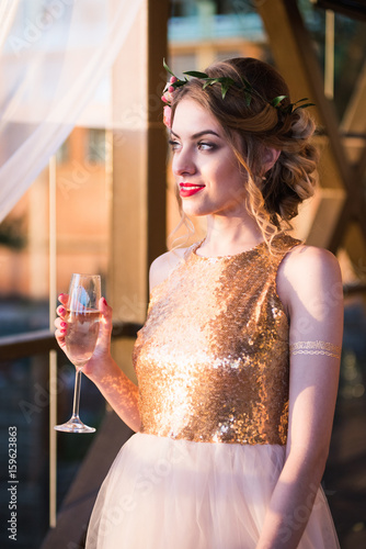 Wallpaper Mural Beautiful young woman tasting wine in a restaurant during the sunset. Relaxation during vacations and travel. Happiness and joy as a lifestyle. Wedding and graduation concept. Torontodigital.ca