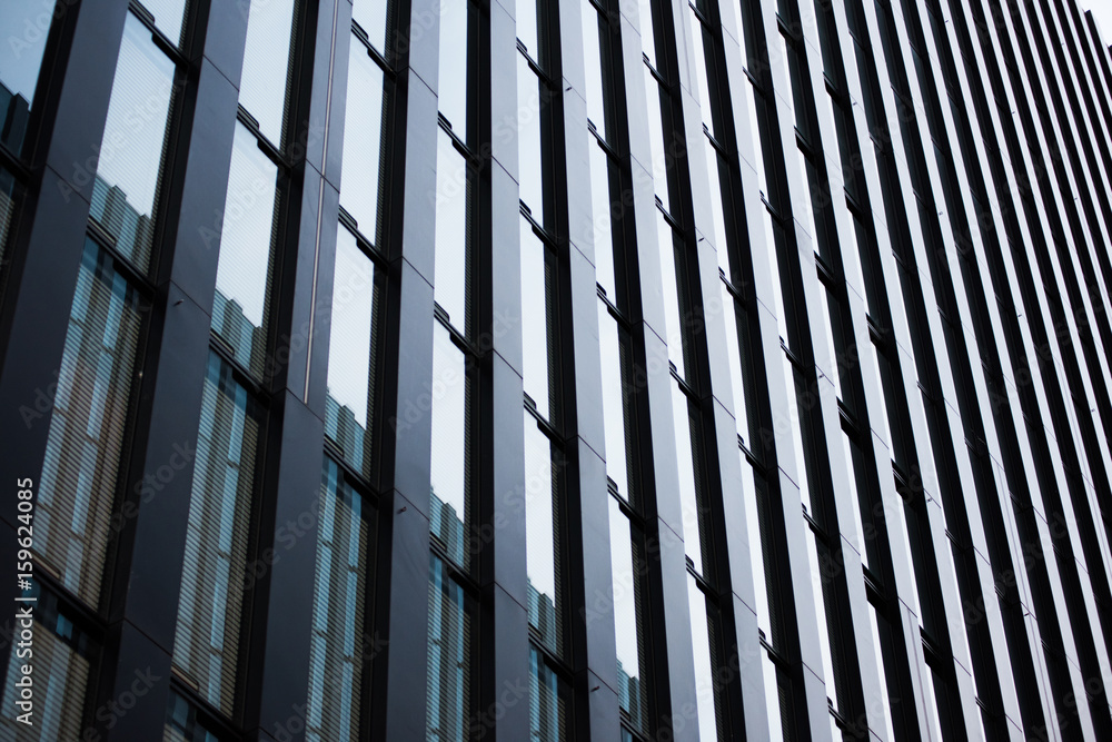 custom made wallpaper toronto digitalUnderside panoramic and perspective view to steel blue glass high rise building. Modern skyscrapers in business district in light at sunset.