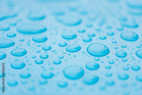 Drops of water on a blue  azure surface. Seamless texture. Pattern. Backdrop