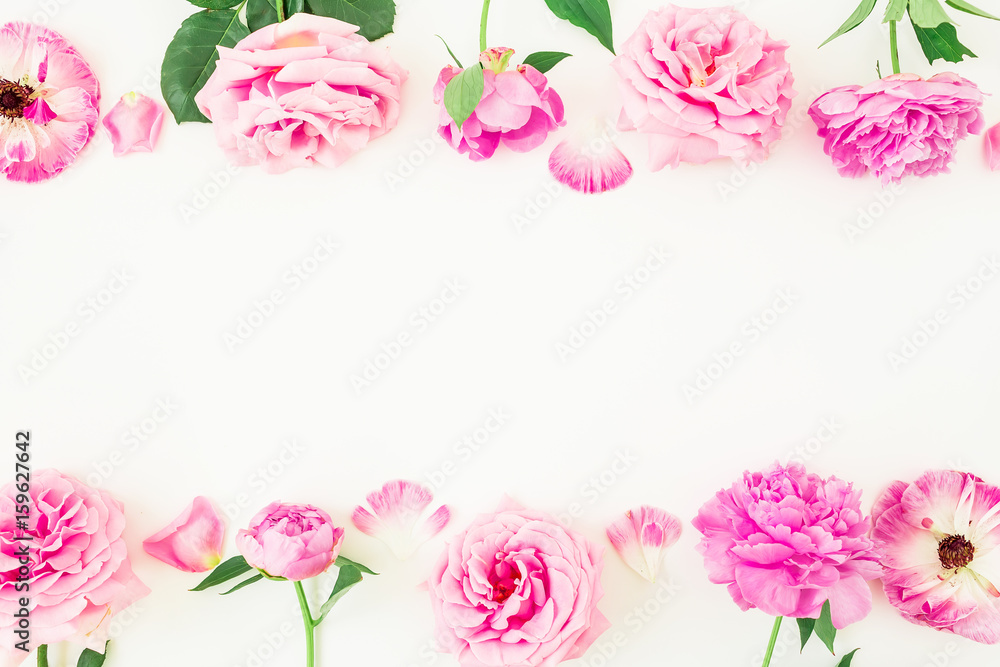 Frame made of pink roses and peony on white background. Summer floral composition. Flat lay, top view.