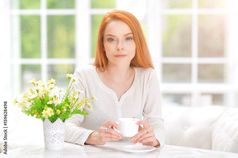 young woman with cup of tea young woman with cup of tea