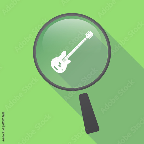 Long shadow loupe with  a four string electric bass guitar