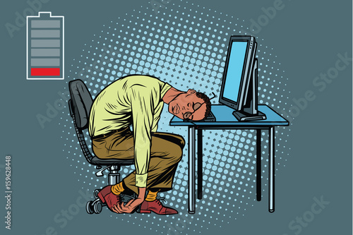 sleeping African businessman at the computer