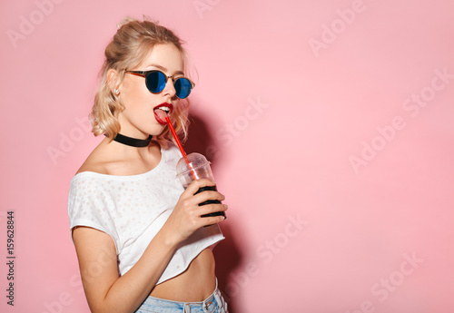 Lovely hipster drinking cola