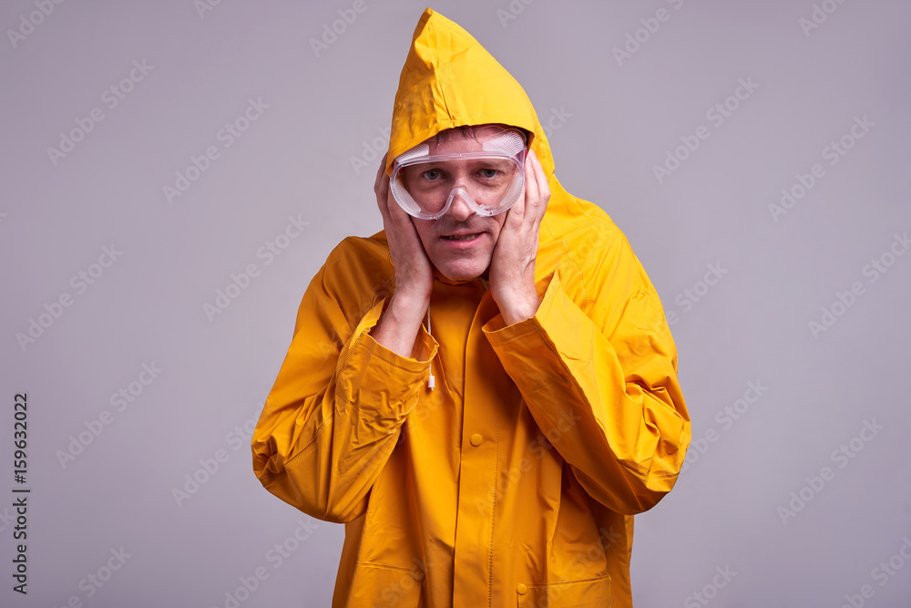 Man in yellow raincoat