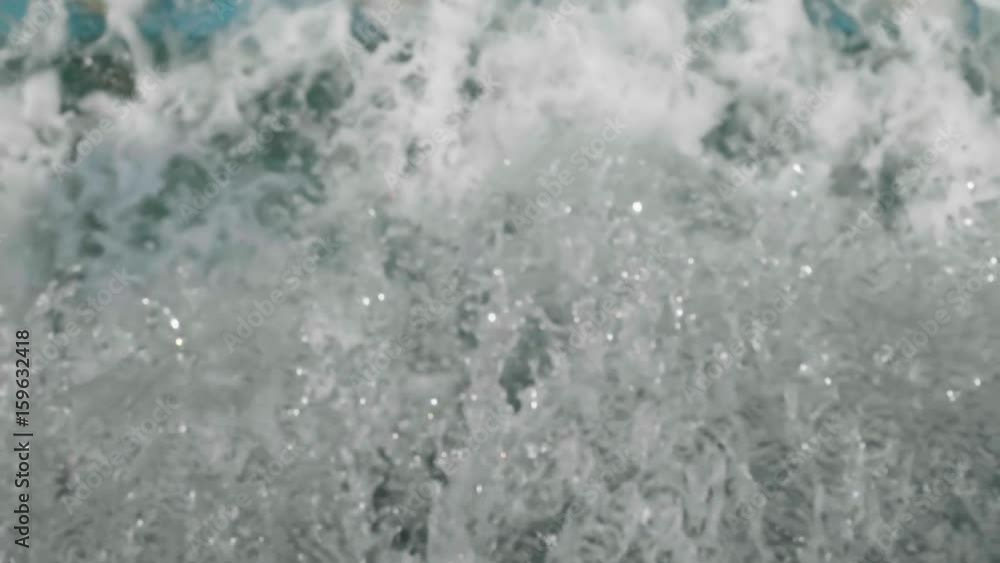 Water flow of fountain falling down into water making foam. Water flow of fountain falling down into water making foam.