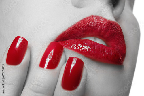Woman with red lips and nai...