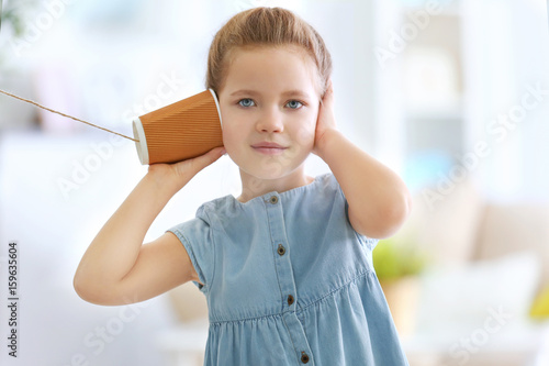 Cute little girl using plas...