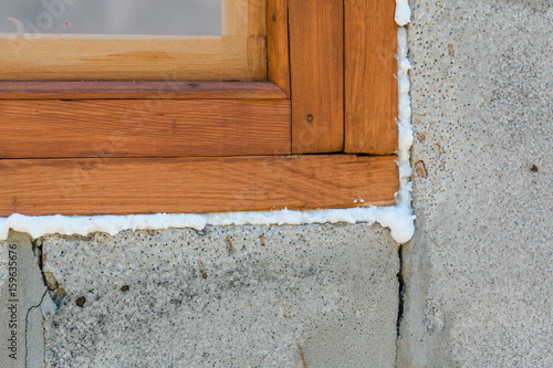 Construction foam. Foam of a stroiteln at a window.