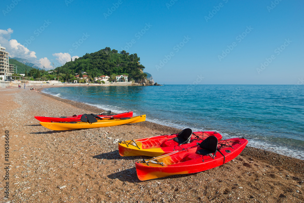 Kayaks on the sea beach in Montenegro, extreme sports