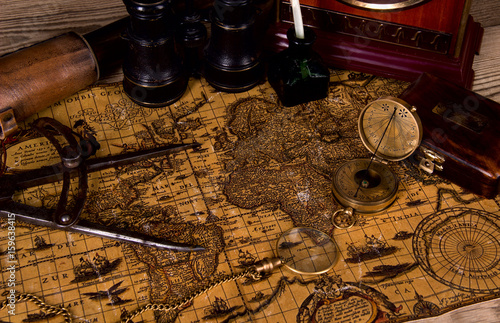 Ancient world map with a variety of accessoriesin vintage still. photo