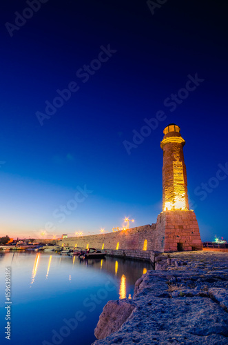 Old Venetian harbor of Rethimno with the Egyptian lighthouse at night, Crete, Greece