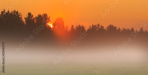 Foggy sunset at countryside in Finland