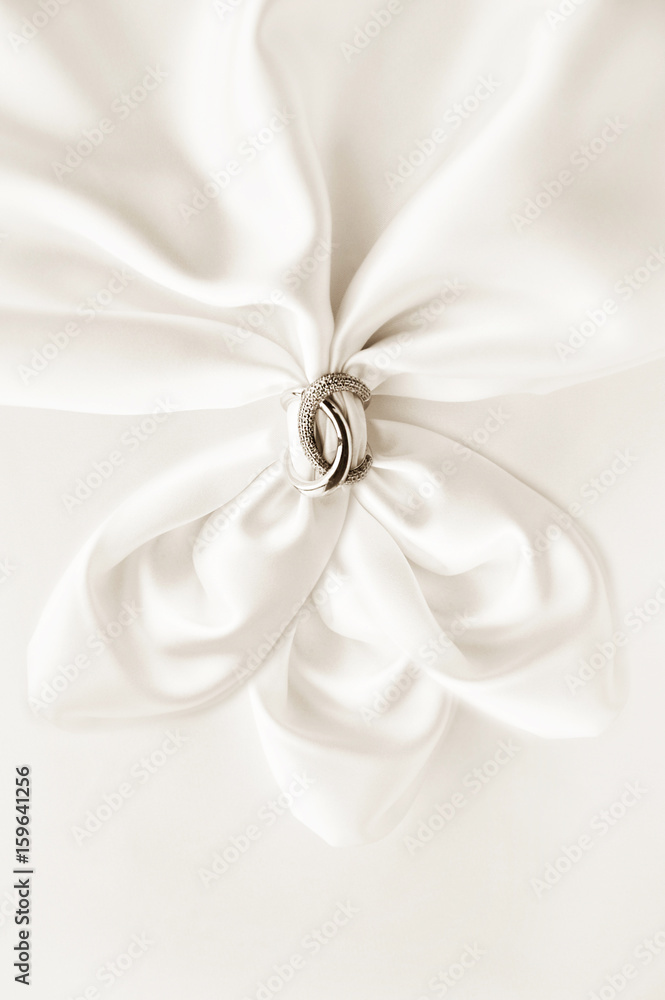 White draped silk with luxury ring White draped silk with luxury ring