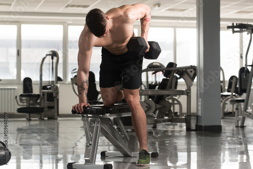 Back Exercise With Dumbbells In A Gym