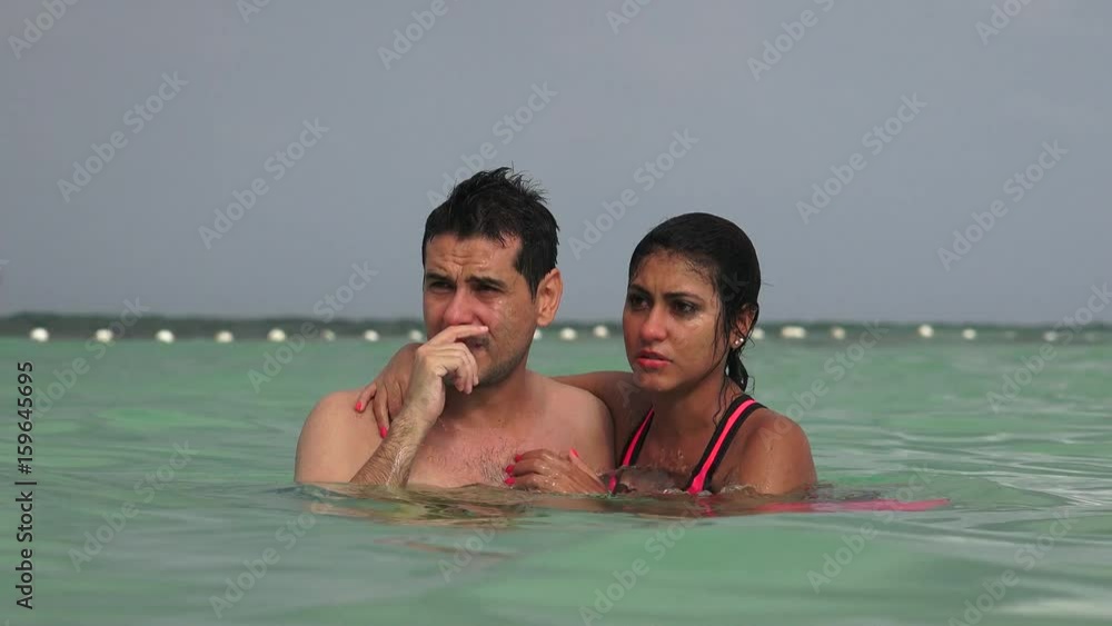 Man And Woman Swimming In Ocean And Talking Man And Woman Swimming In Ocean And Talking