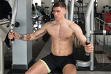 Muscular Man Exercising Chest