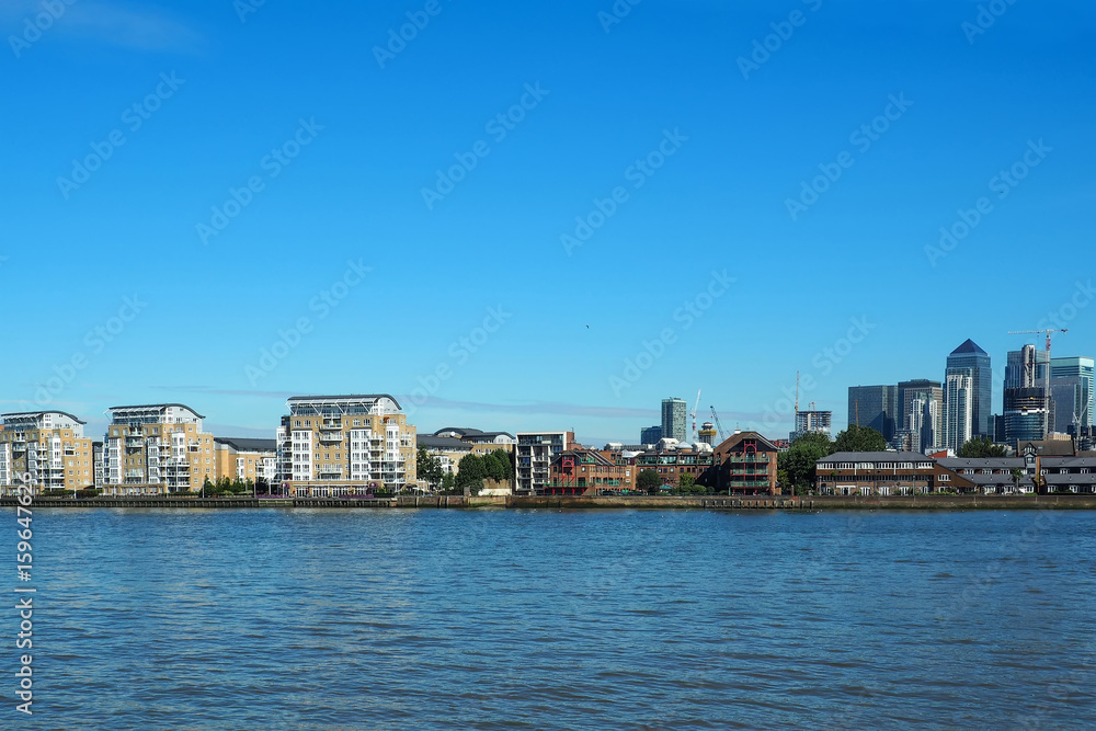 The view of river Thames and Canary Wharf business centre in London, UK seen from Greenwich.