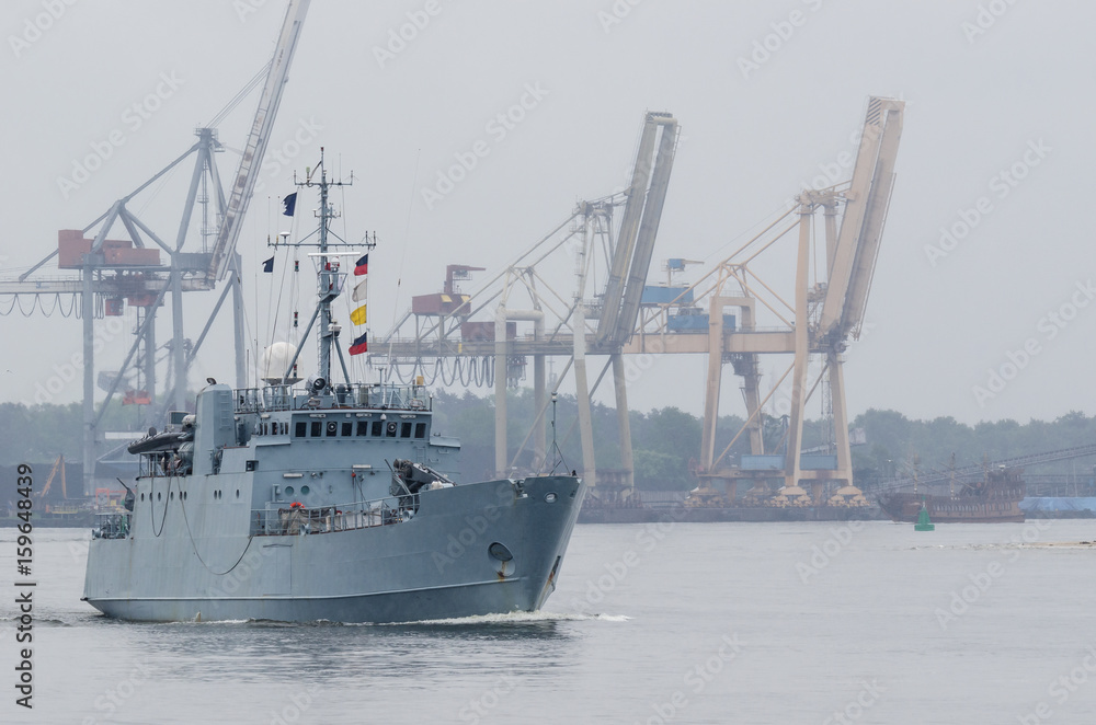 MINEHUNTER - Estonian warship against the background of the port of Swinoujscie MINEHUNTER - Estonian warship against the background of the port of Swinoujscie