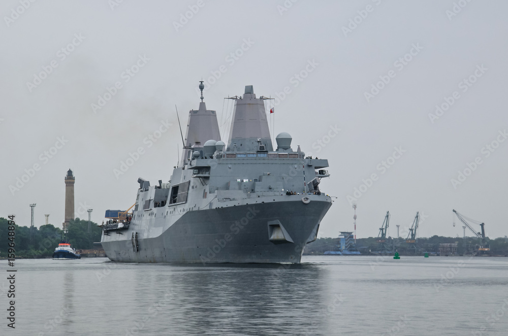 LANDING CRAFT - An American warship sails out of the harbor LANDING CRAFT - An American warship sails out of the harbor