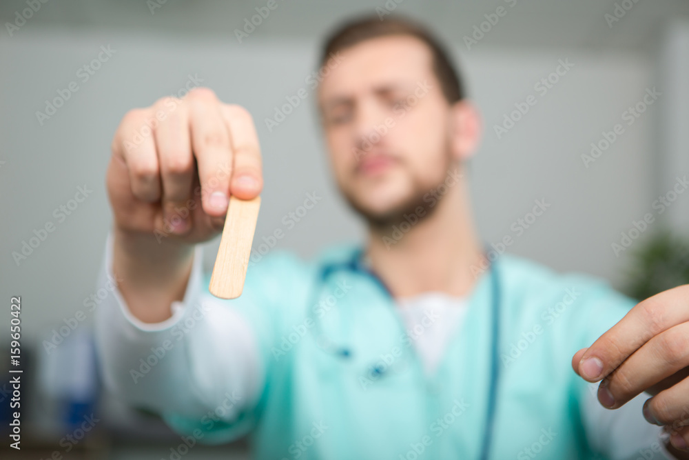 doctor showing sticking plaster on a finger