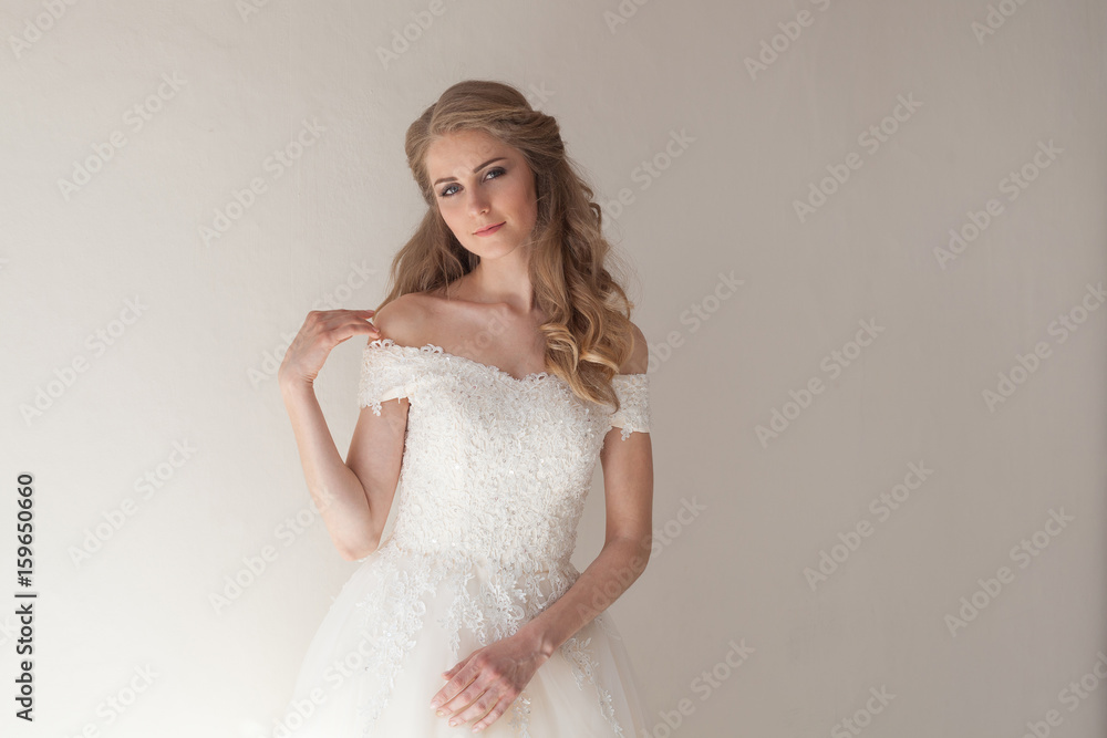 a portrait of the bride before the wedding in white dress a portrait of the bride before the wedding in white dress