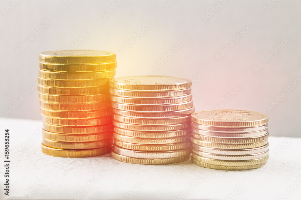 Stacks of Russian coins on a gray background with droplets of water. Stacks of Russian coins on a gray background with droplets of water.