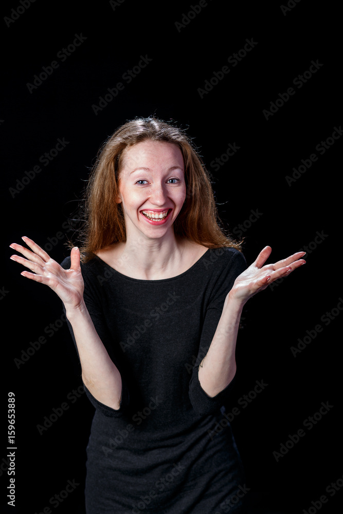 Cheerful young woman smiling spreading her hands to the sides Cheerful young woman smiling spreading her hands to the sides