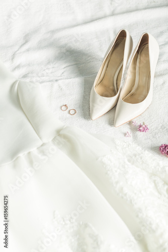 Wedding image of the bride: dress, shoes and rings