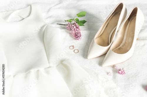 Wedding image of the bride: dress, shoes and rings