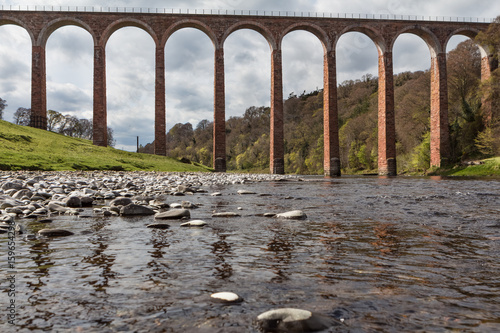 Low angle view of Leaderfoot Viaduct from the river Tweed, in the Scottish Borders photo