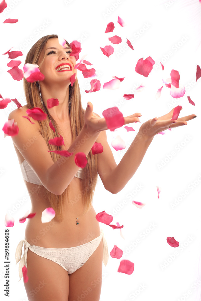Beautiful young woman portrait with rose petals Beautiful young woman portrait with rose petals