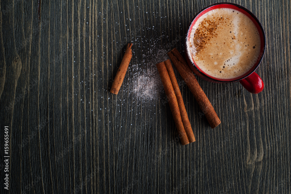 Ceramics red cup of coffee with cinnamon Ceramics red cup of coffee with cinnamon