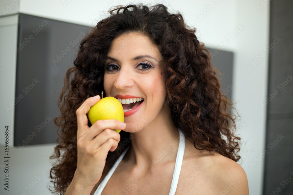 Young woman eating a healthy apple Young woman eating a healthy apple