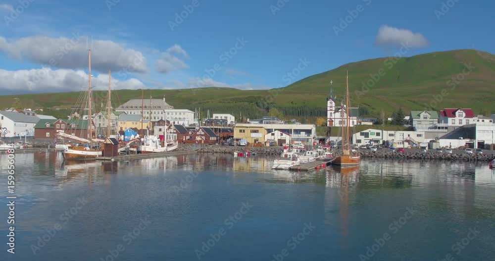 HUSAVÍK, ICELAND – SEPTEMBER 2016 : Aerial shot of Husavík Bay on a beautiful day with boats and ships in view HUSAVÍK, ICELAND – SEPTEMBER 2016 : Aerial shot of Husavík Bay on a beautiful day with boats and ships in view