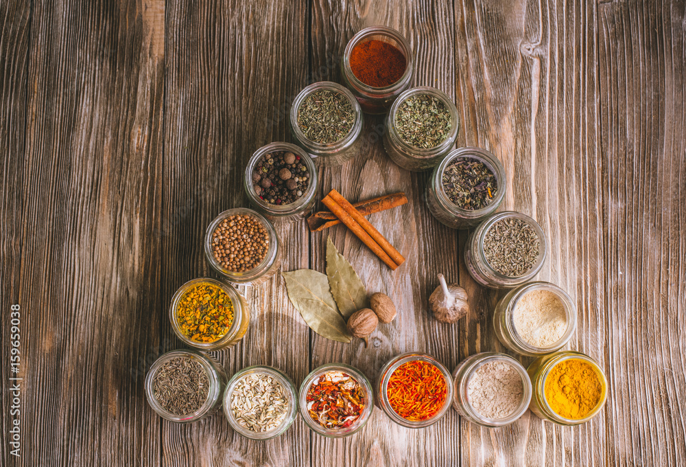 Various colorful kinds of spices on rustic wooden table, top view Various colorful kinds of spices on rustic wooden table, top view