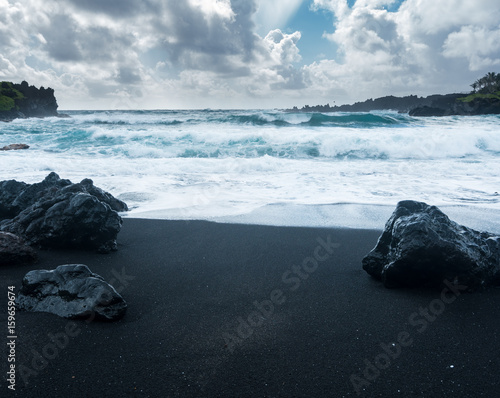 Black sand beach at Waianapanapa on the road to Hana in Maui