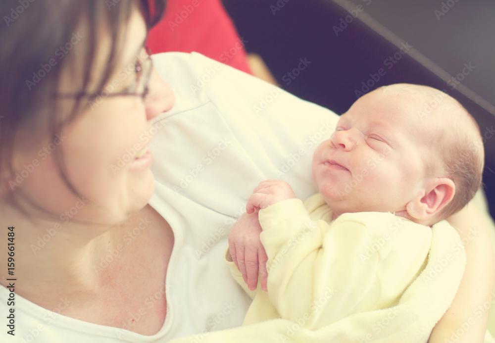 Woman with her cute newborn baby Woman with her cute newborn baby