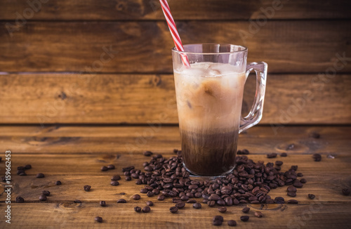 iced coffee on rustic wooden background.