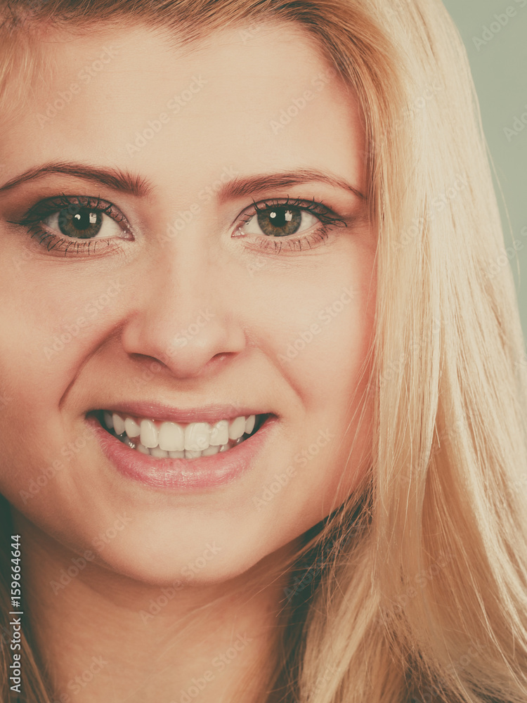 Closeup portrait of happy attractive blonde woman